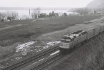 An Amtrak train passes by a vacant area that was once home to a PRR facility